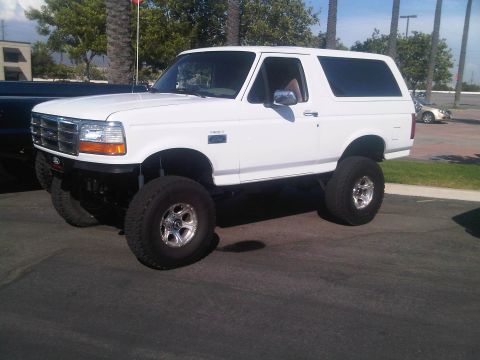 1986 Ford Bronco - This lifted Ford Bronco features aftermarket wheels and tires, giving it a stance.