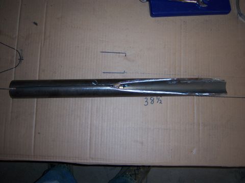 1996 Ford Bronco - A metal tube is marked with measurements, likely for a custom build or repair.