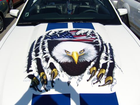 2007 Ford Mustang - White Ford Mustang with racing stripes and an eagle graphic on the hood.