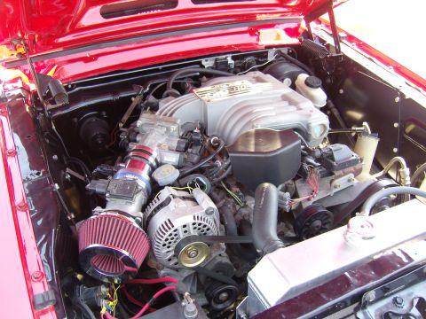 2007 Ford Mustang - A close-up view of a car's engine bay, highlighting the V8 engine and its components.