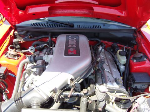 2007 Ford Mustang - Engine bay view of a Ford Mustang Cobra, showing the intake manifold and valve covers.