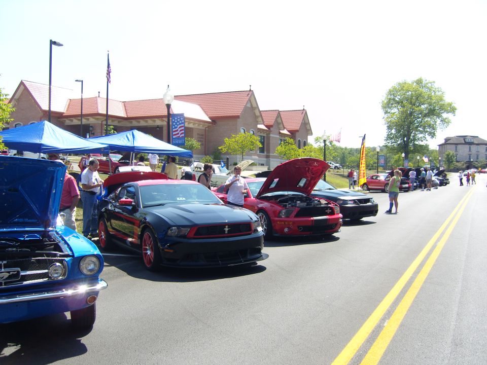 Black and red 2007 Ford Mustang with red accents and hood open