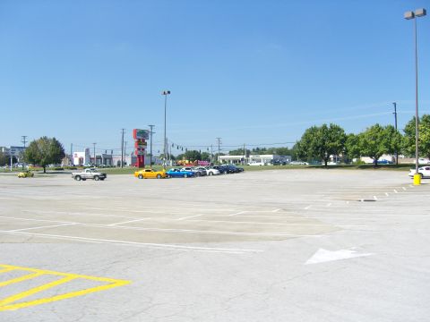 2007 Ford Mustang - A parking lot scene with multiple cars visible under a clear blue sky.