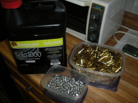 1996 Ford Bronco - Reloading supplies including propellant, casings, and bullets are shown next to a toaster oven.