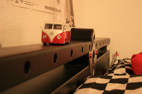 1973 Ford Ranchero - Toy Volkswagen bus sits on a shelf next to a checkered blanket.