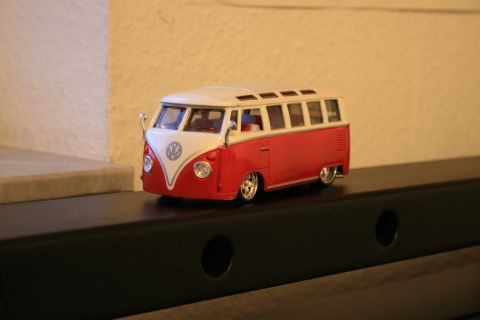 1973 Ford Ranchero - A detailed model of a Volkswagen Type 2 Bus is displayed on a shelf.