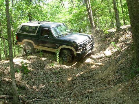 1983 Ford Bronco - This turn is hairy because there's nothing to gauge "level" from, other than the trees, and it's a tight turn into a blind dropoff, making…
