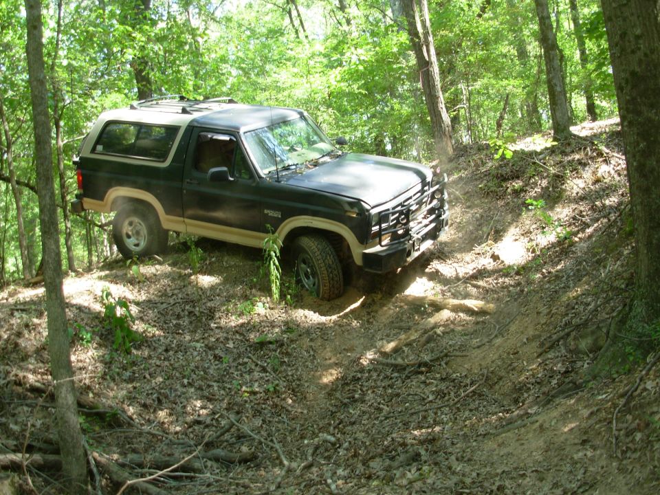 This turn is hairy because there's nothing to gauge "level" from, other than the trees, and it's a tight turn into a blind dropoff, making it off-camber.