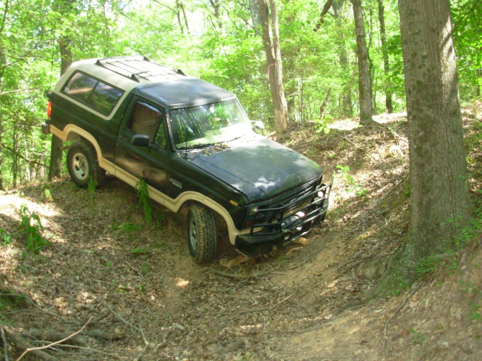 It came out a lot more easily than I expected - I didn't even need the winch to get here.  But there had always been a stump that made this little hilltop tricky, so I pulled it out today.
