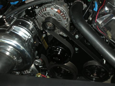 1992 Ford Crown Victoria - Engine bay components including a supercharger and alternator are visible with a serpentine belt drive system.