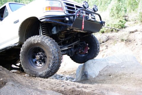 1995 Ford Bronco - This 1995 Ford Bronco navigates a rocky trail with its large off-road tires and custom brush guard.