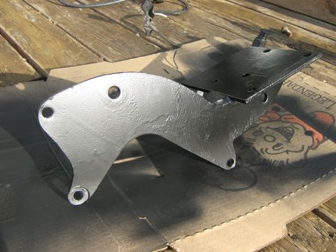 1972 Ford F-250 - A metal bracket, recently painted, sits on a piece of cardboard with a cartoon graphic.