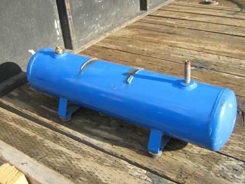 1972 Ford F-250 - A blue air tank with brass fittings rests on weathered wooden planks.