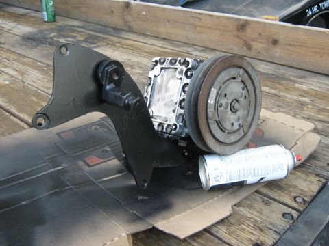 1972 Ford F-250 - Air conditioning compressor and mounting bracket, likely for a vehicle restoration project.