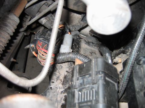 1992 Ford Bronco - This image shows a close-up view of a vehicle's complex wiring harness, various connectors and bundles of wires.