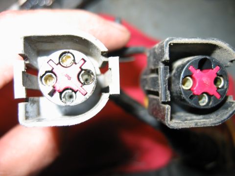 1992 Ford Bronco - Close-up view of two electrical connectors, likely for a vehicle's wiring harness.