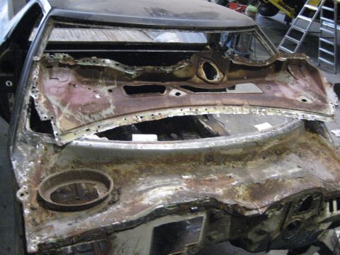 1973 Ford Ranchero - This 1973 Ford Ranchero shows significant rust damage to its dashboard and cowl area, indicating a major restoration project.