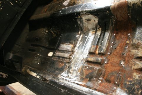 1973 Ford Ranchero - The floor pan shows significant rust and has undergone welding repairs.