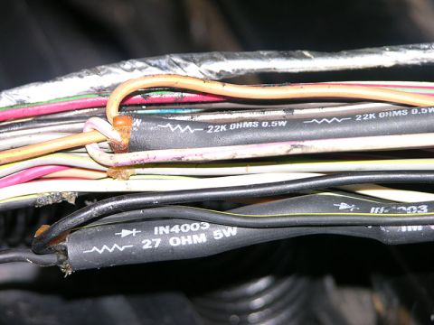 1990 Ford Bronco - A close-up view shows a bundle of wires, some with resistors and their specifications printed on the insulation.