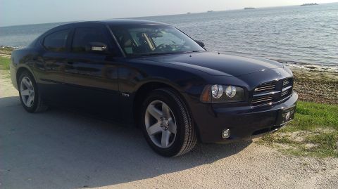 2006 Dodge Charger - Dark blue 2006 Dodge Charger seen from the front-right angle near the ocean.