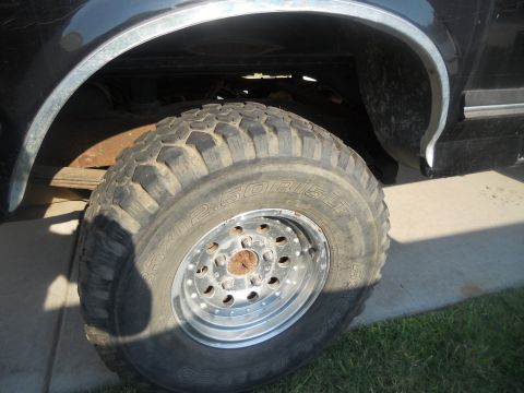 1991 Ford Bronco - 1991 Ford Bronco rear wheel and fender flare detail.