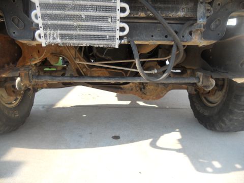 1991 Ford Bronco - A close-up view of the vehicle's undercarriage, showing the radiator and suspension system.