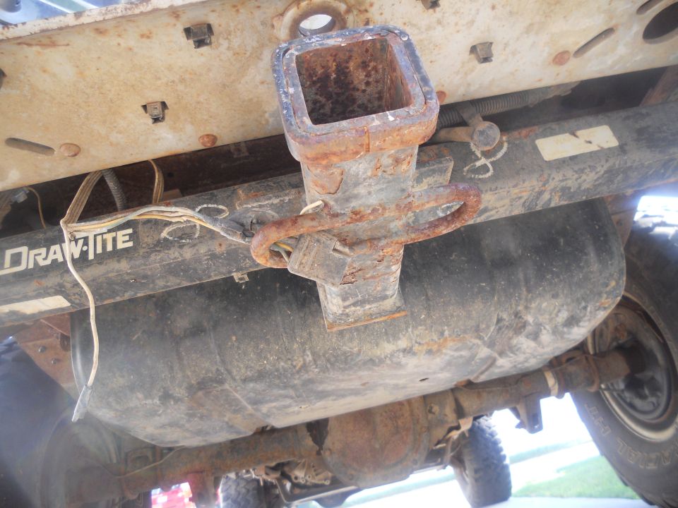 Undercarriage view of a Draw-Tite hitch and fuel tank