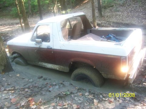 1989 Ford Bronco - This 1989 Ford Bronco is stuck deep in the mud on a trail.