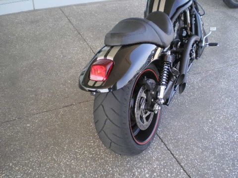 2008 Harley-Davidson VROD VRSCD - Rear view of a black motorcycle with silver racing stripes on the fender and dual exhaust pipes.