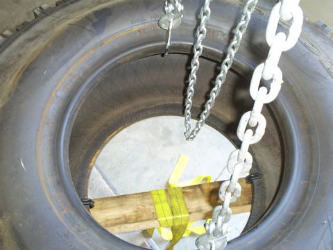 1992 Ford Bronco - A tire is secured with chains and straps, with a Supermotors.net logo in the corner.