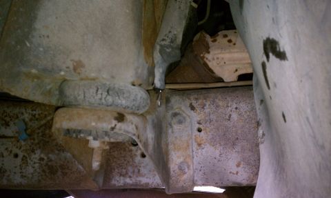 1979 Ford Bronco - Heavily rusted frame and suspension components are visible in this close-up view.