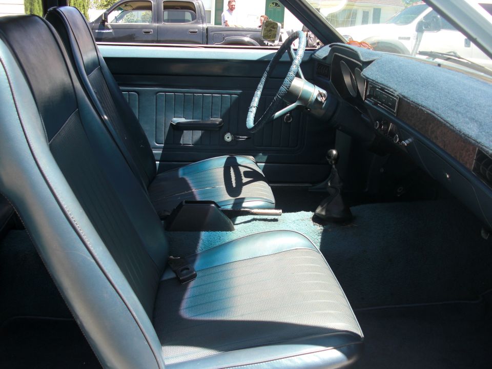 1972 Ford Pinto interior showing front seats, dashboard, and steering wheel