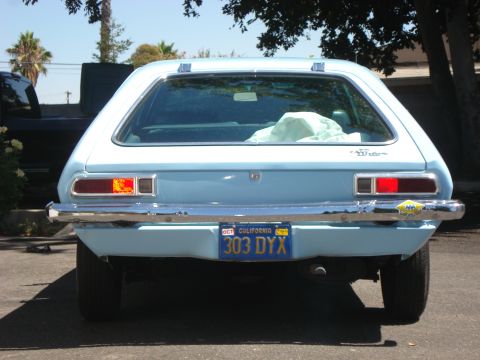 1972 Ford Pinto - Rear view of a 1972 Ford Pinto hatchback, showing its distinctive taillights and chrome bumper.
