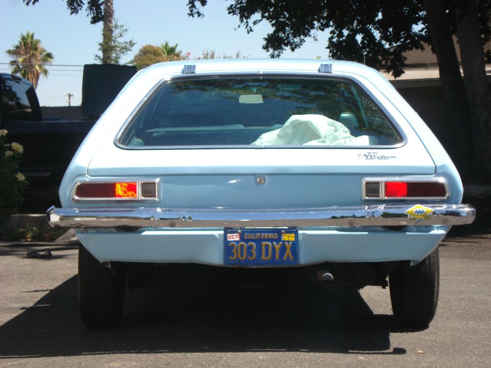 1972 Ford Pinto rear view, light blue hatchback with California plates