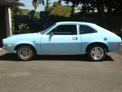 1972 Ford Pinto - This 1972 Ford Pinto coupe is seen from the side, its light blue paint and classic body style.