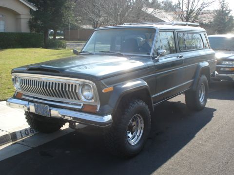 1972 Ford Pinto - This Jeep Cherokee, likely from the mid-1970s, is parked curbside next to another vehicle.
