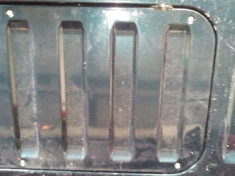 1994 Ford Bronco - Detail of a vehicle's front grille section.