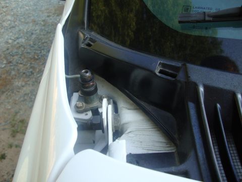 2002 Chevrolet Silverado 1500 - The windshield wiper mechanism is visible on the passenger side of the vehicle.
