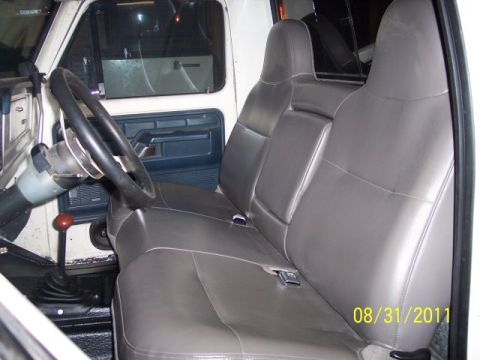 1973 Ford F-250 - Interior view of a 1973 Ford F-250, a bench seat and steering wheel.