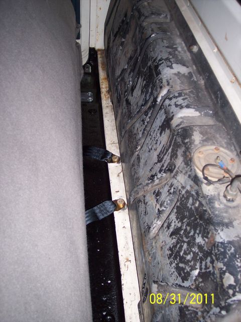 1973 Ford F-250 - The photo shows the fuel tank and seatbelts inside a vehicle, with a date stamp of 08/31/2011.