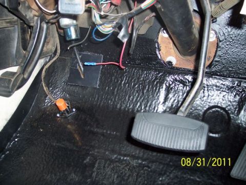 1973 Ford F-250 - Close-up view of the interior floor of a vehicle, showing pedals, exposed wiring, and a custom switch. The date 08/31/2011 is visible.