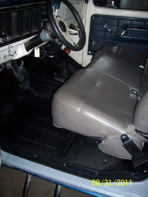 1973 Ford F-250 - Interior view of a 1973 Ford F-250, the bench seat and steering wheel.