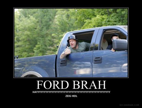 1900 Acura CL - Man in blue pickup truck wearing a helmet gives a thumbs up.