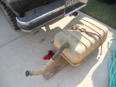 1991 Ford Bronco - Fuel tank removed from a 1991 Ford Bronco, showing the rear bumper and license plate.