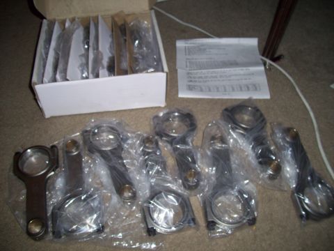 1995 Ford Probe - Engine connecting rods are shown in a box and individually wrapped with instructions.