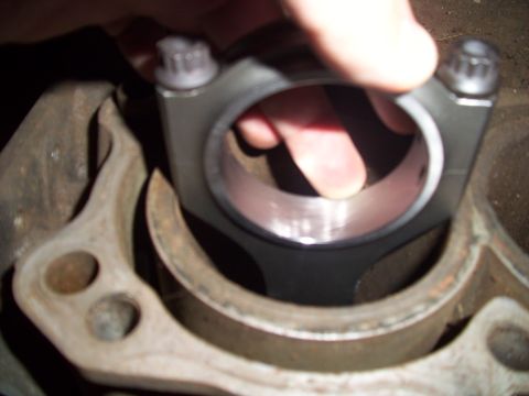 1995 Ford Probe - Installing a connecting rod cap onto an engine cylinder bore.