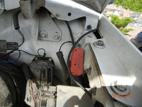 1996 Ford Bronco - This image shows a section of a vehicle's engine bay, focusing on electrical wiring and components, including an ABS module.