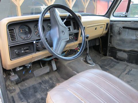 1987 Dodge 1500 - Interior view of a 1987 Dodge 1500, showing the dashboard, steering wheel, and driver's seat.