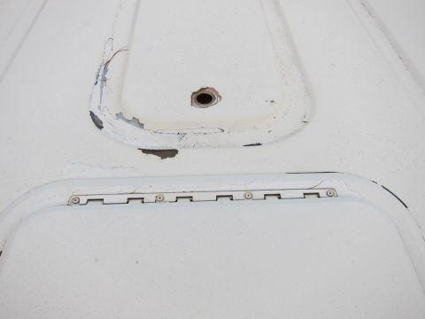 1987 Dodge 1500 - Close-up of a white panel showing two recessed areas and a visible hinge mechanism.