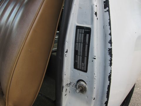1987 Dodge 1500 - Vehicle identification plate visible in the door jamb.